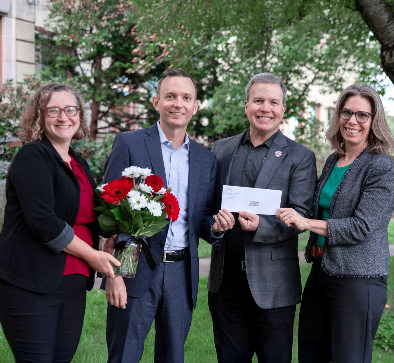 Group gathers to celebrate health care workforce training grant for Rogue Valley, Oregon.